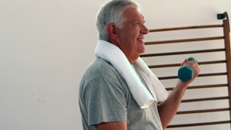 Elderly-man-lifting-hand-weights