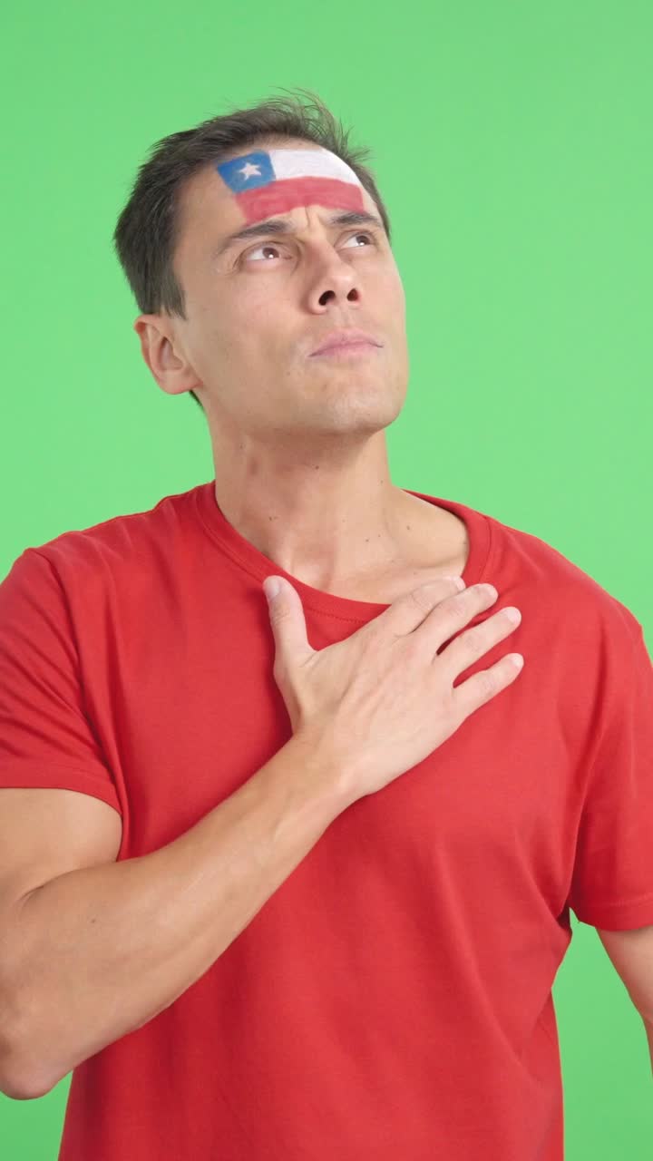 Man listening to the Chile national anthem with solemnity