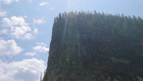 beautiful view of a rocky mountain top from the hiking trail up to lake agnes tea house on mount st. piran and mount whyte, within banff national park near lake louise alberta.