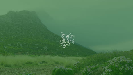 animation of happy earth day text over landscape