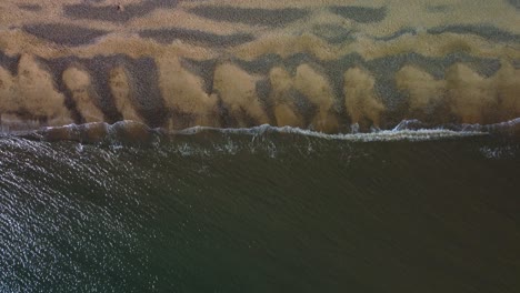 birds eye shot of the waves at gorleston-on-sea beach, norfolk