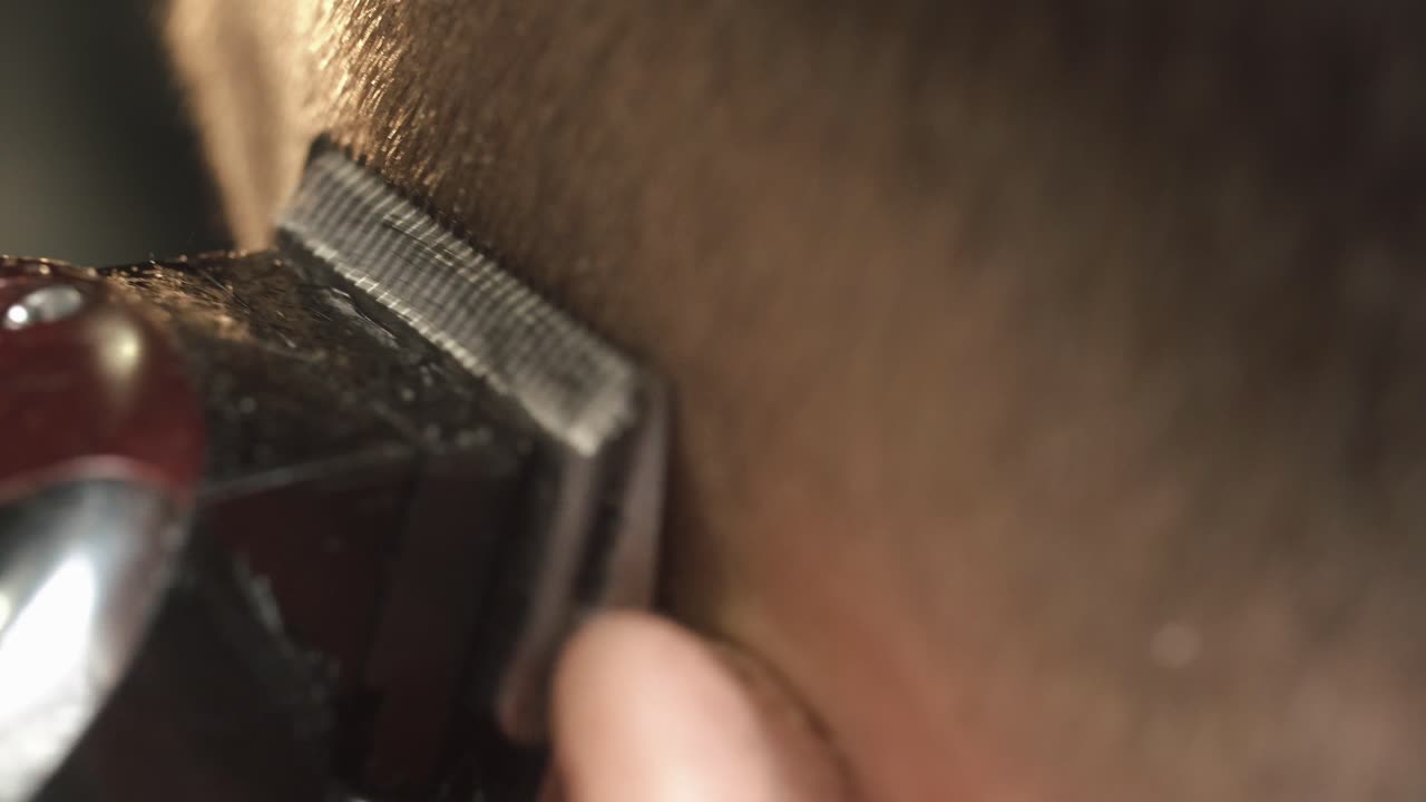 Close-up of Hair Being Cut with a Clipper
