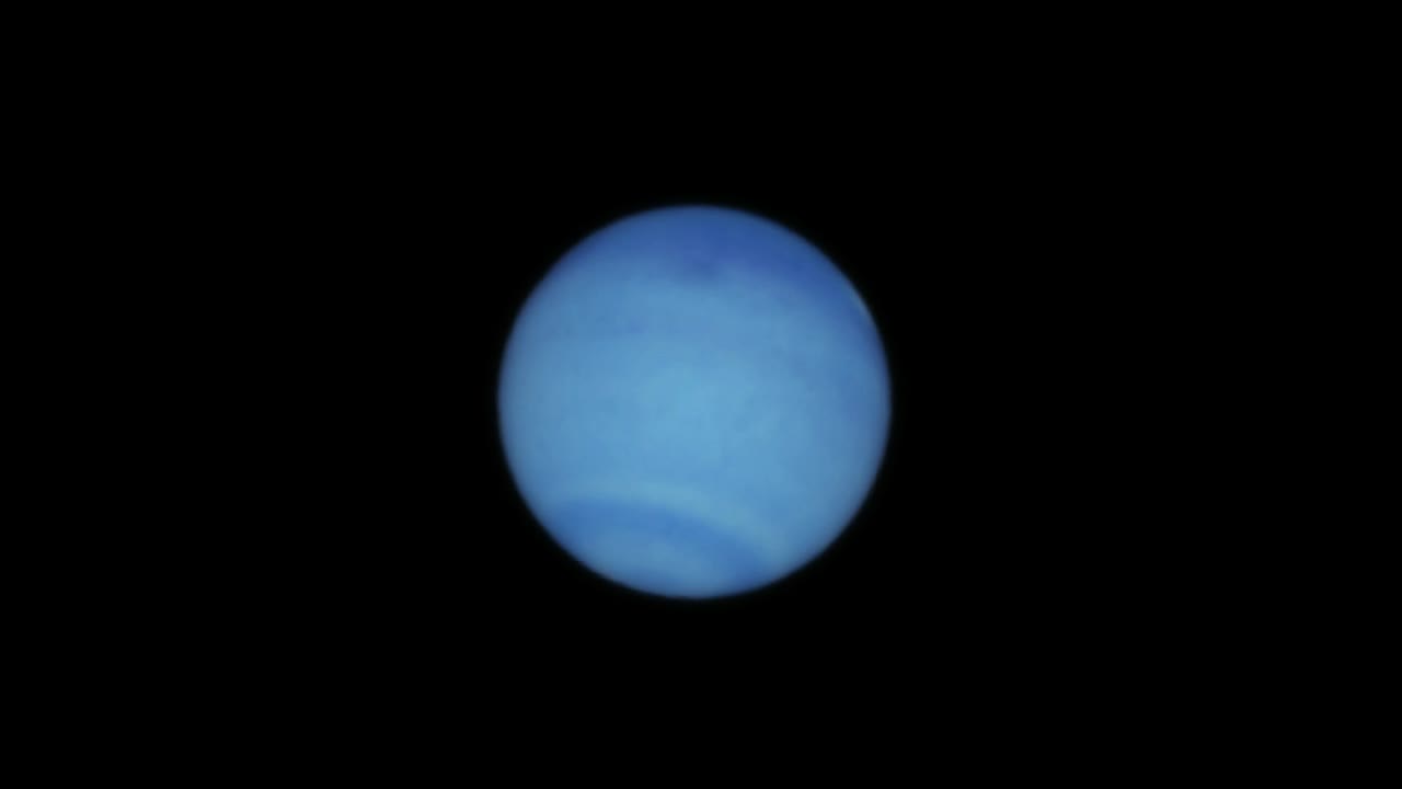 Animation depicting Neptune orbiting in outer space.