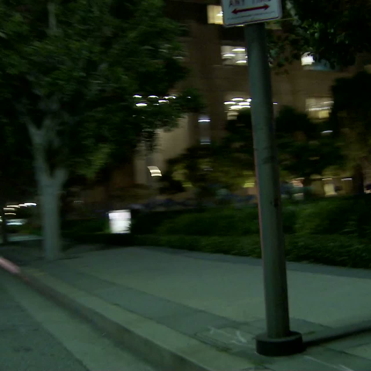 A Car Travels Along A Street At Night In Century City Los Angeles As Seen Through The Side Window 4