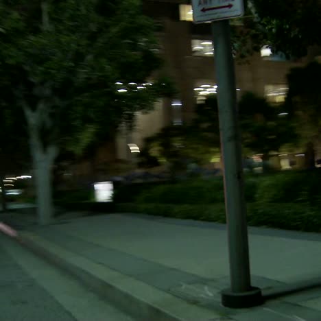 A-Car-Travels-Along-A-Street-At-Night-In-Century-City-Los-Angeles-As-Seen-Through-The-Side-Window-4