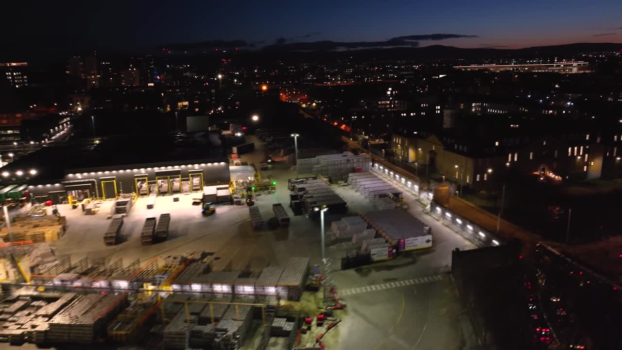 4K cinematic drone footage of the Guinness Factory exterior in Dublin, highlighting warehouse logistics, trucks, forklifts in motion, and the bustling industrial atmosphere._044