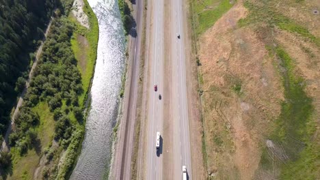 arial footage of river and highway running side by side on usa's westcoast