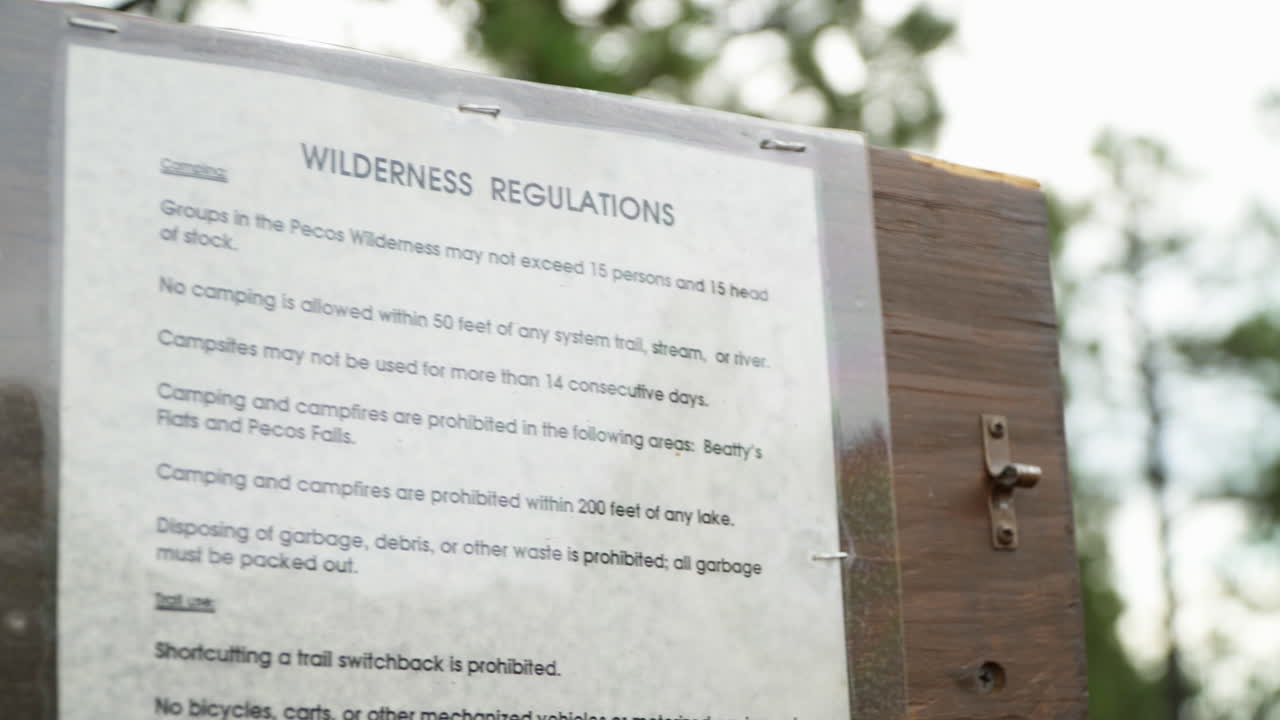 The wilderness regulations listed at the start of a hiking trail.