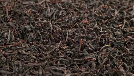 looped spinning dry black tea full frame close-up background