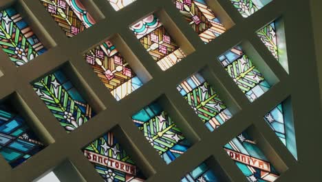intricate stained glass window in a church sanctuary