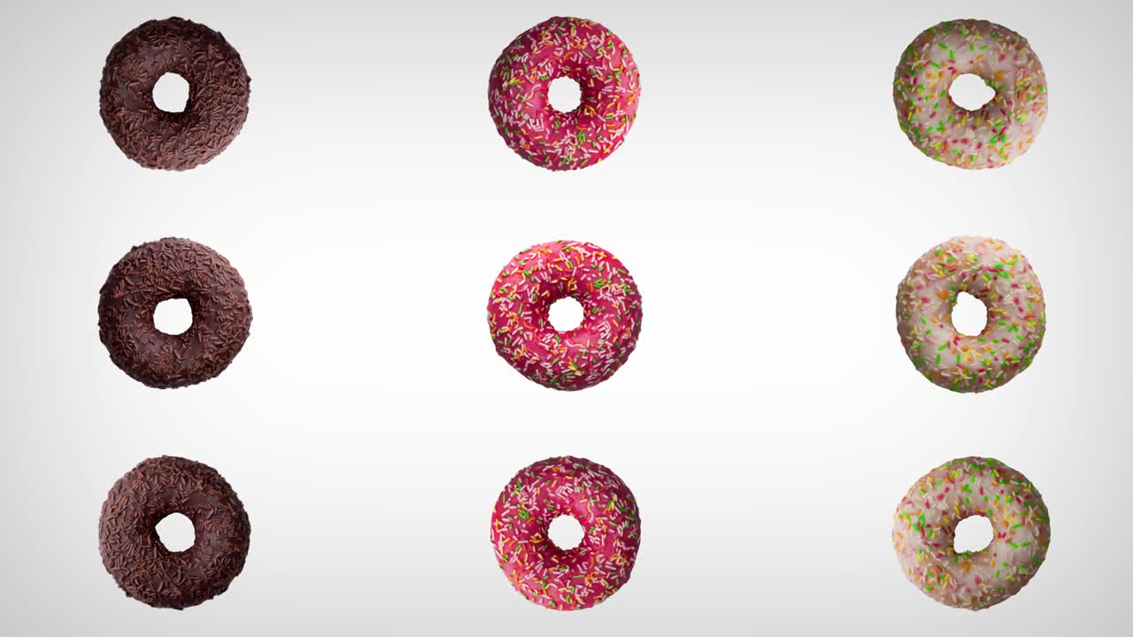 rotación abstracta de tres rosquillas de diferentes colores sobre un fondo blanco