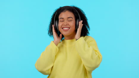 African-woman,-headphones-and-dancing-in-studio