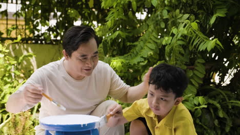 Asian-man-and-boy-in-the-backyard