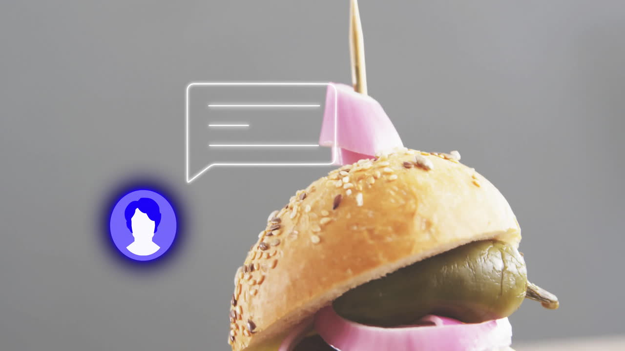 Animation of burger with pickle and onion showing chat icon and speech bubble