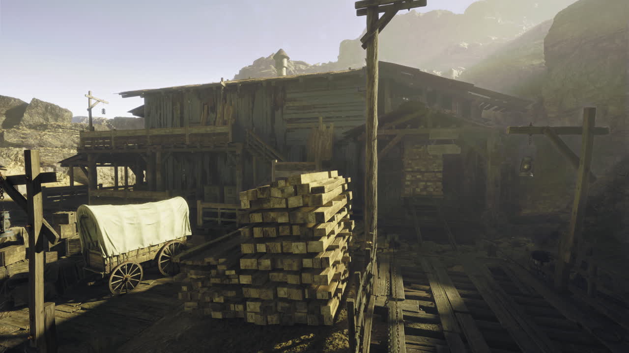 Old wooden mining structure with wagon and stacked timber in a rocky area
