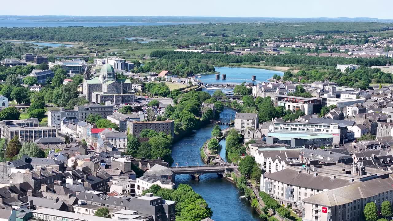 Birds eye view of Galway Cathedral and river surrounded by historical buildings. Ireland
