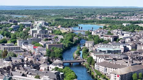 birds eye view of galway cathedral and river surrounded by historical buildings. ireland