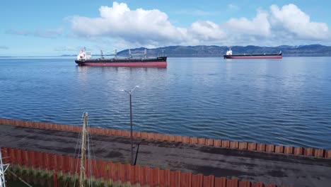 cargo ships arriving in port