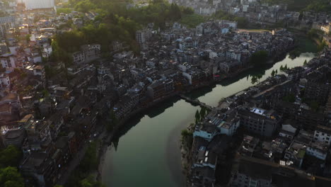 aerial view tilting over the fenghuang county, phoenix ancient city, sunrise in china