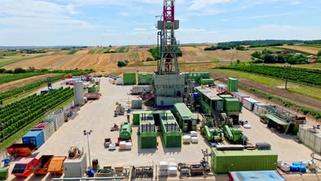 oil and gas land drilling rig onshore in austria - aerial drone shot