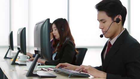 Business-people-wearing-headset-working-in-office