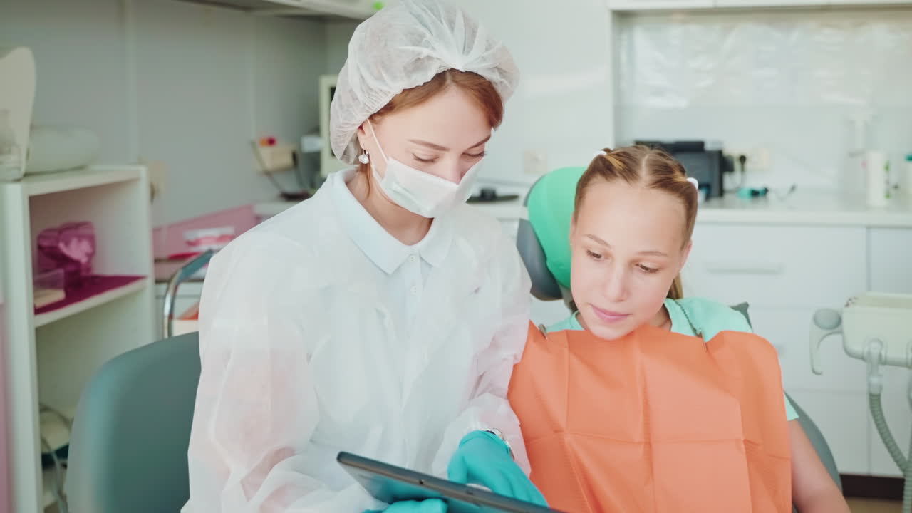 Dentist Examining a Young Patient