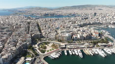 Aerial-dolly-shot-over-Luxury-Marina-and-buildings,-Marina-Zeas-in-Piraeus,-Athens