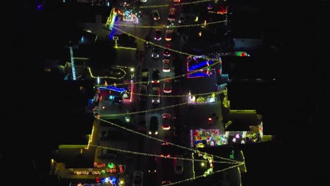 christmas along a main street in a downtown neighborhood - aerial flyover