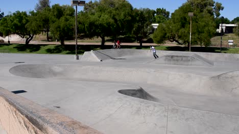 older guy on skateboard  drops into bowl at the wedge skate park