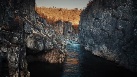 mountain river flowing slowly in the deep canyon