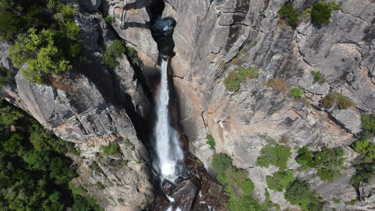 Piscia di Ghjaddu waterfall, Corsica, descending drone shot