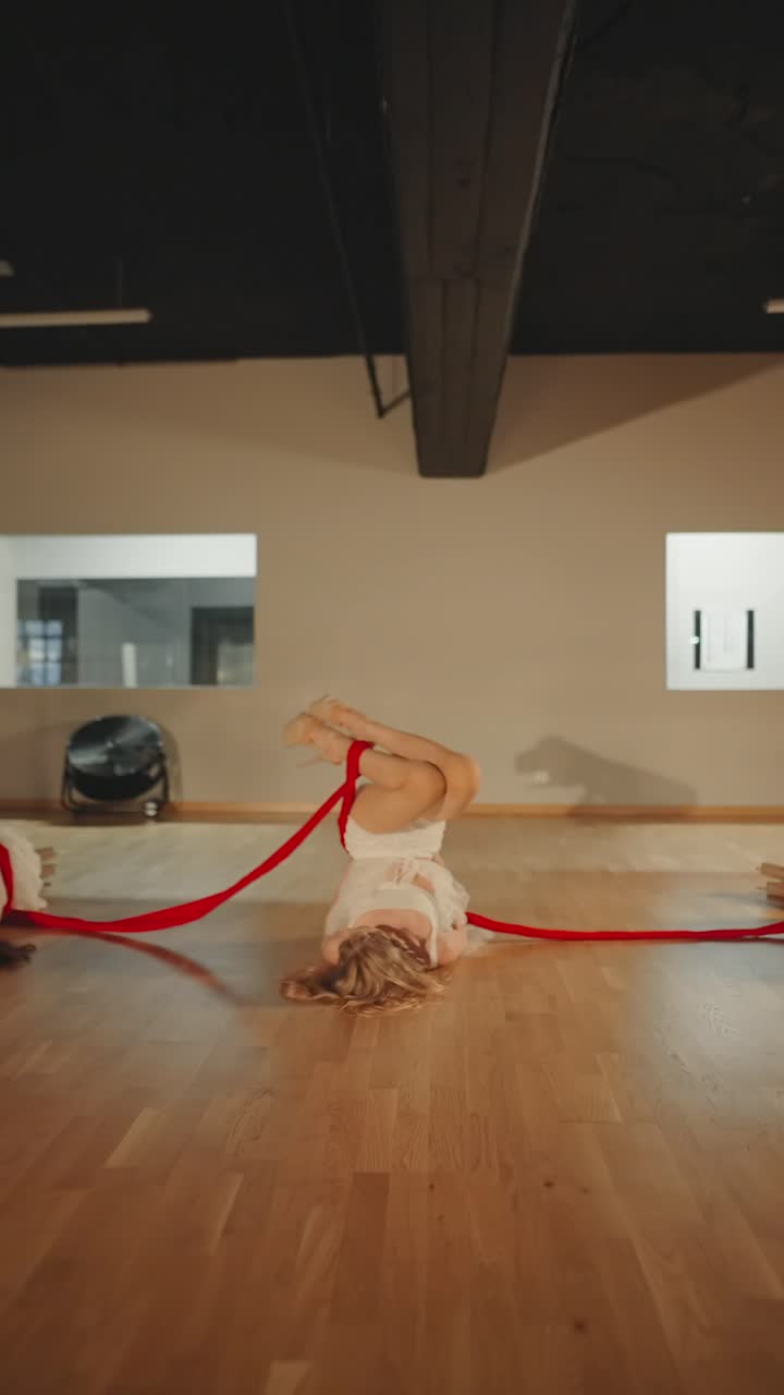 Contemporary Dance Performance with Red Ribbons