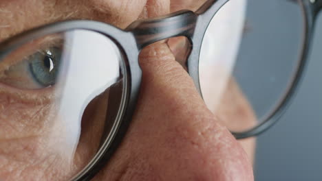 close-up-macro-eyes-old-woman-wearing-glasses-healthy-eyesight-optometry-concept