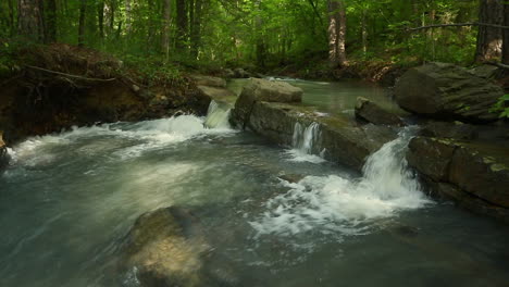 Three-small-waterfalls-flowing-over-a-rock-on-a-creek-in-the-Ouachita-mountains-Arkansas