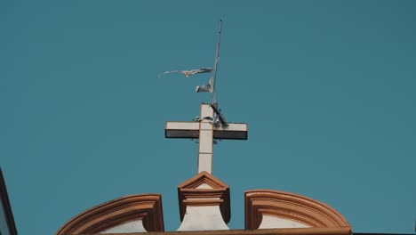 christian cross on rooftop of catedral de san cristóbal mártir in mexico