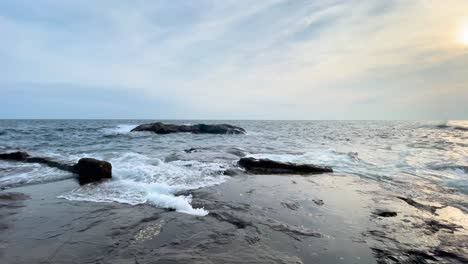 View-from-Enoshima-island-Japan-of-the-ocean-waves-crashing-on-to-rocks-during-the-evening