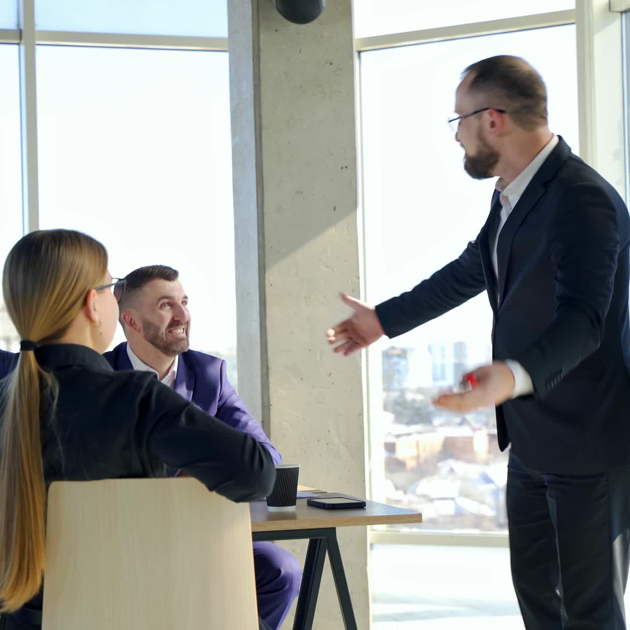 Happy business team discussing together at office meeting with laptop. Brainstorming at the office