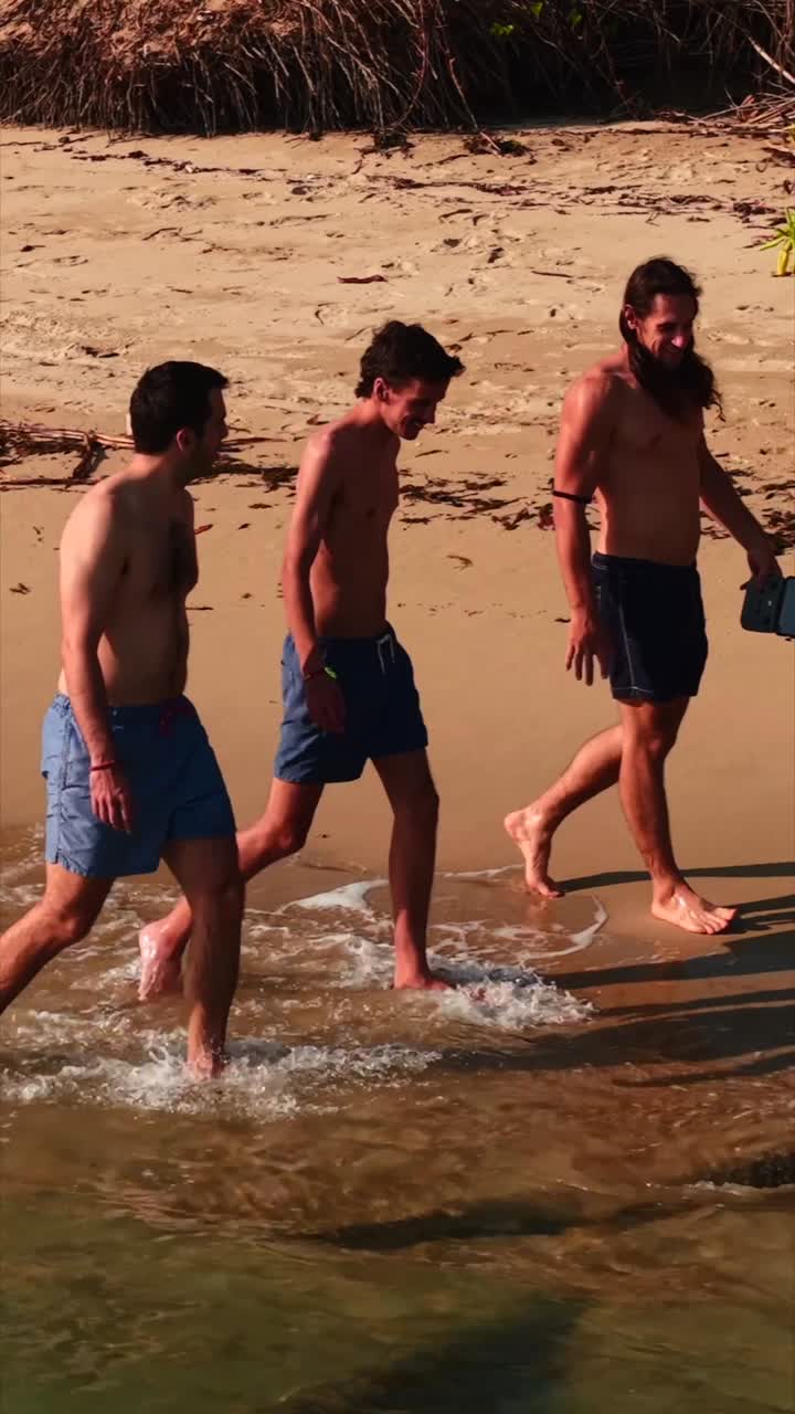 Men Walking on a Beach