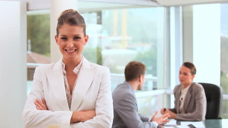 smiling businesswoman standing upright