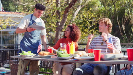 friends celebrating fourth of july with a barbecue
