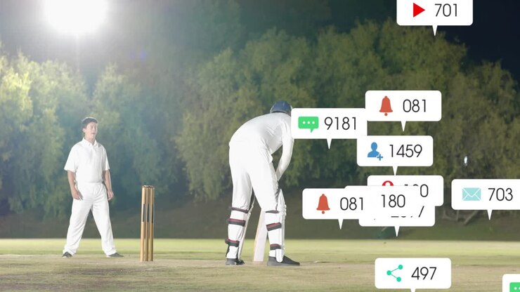 Giocatore di cricket che cambia posizione sotto le luci sul campo da gioco, bolle che si raggruppano mentre si prepara a lanciare