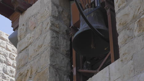 bell in an old structure in israel - low angle shot