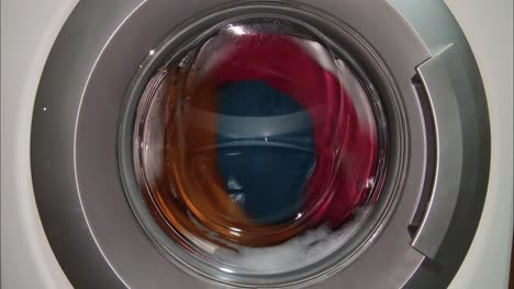 washing machine spinning clothes at high speed. laundry washing clothes.