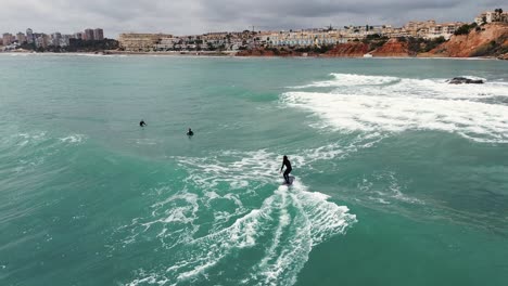 Surfing-waves-drone-view