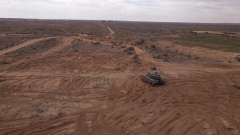 drone view of military tank vehicles in a large military training field, aerial shot