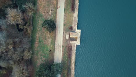 Drone-view-of-this-pond-which-contributes-to-the-regulation-of-the-water-cycle-and-the-preservation-of-aquatic-ecosystems