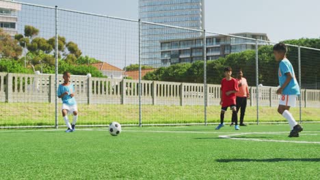 soccer kids playing in a sunny day