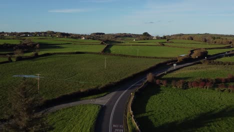 aerial view over vehicles restriction to 20 miles per hour speed limit in rural farming countryside