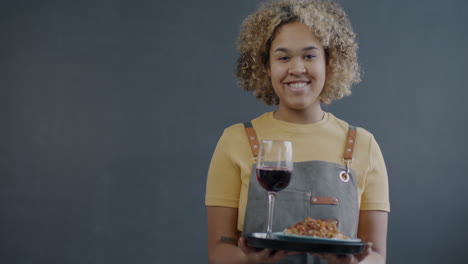 woman serving food and wine