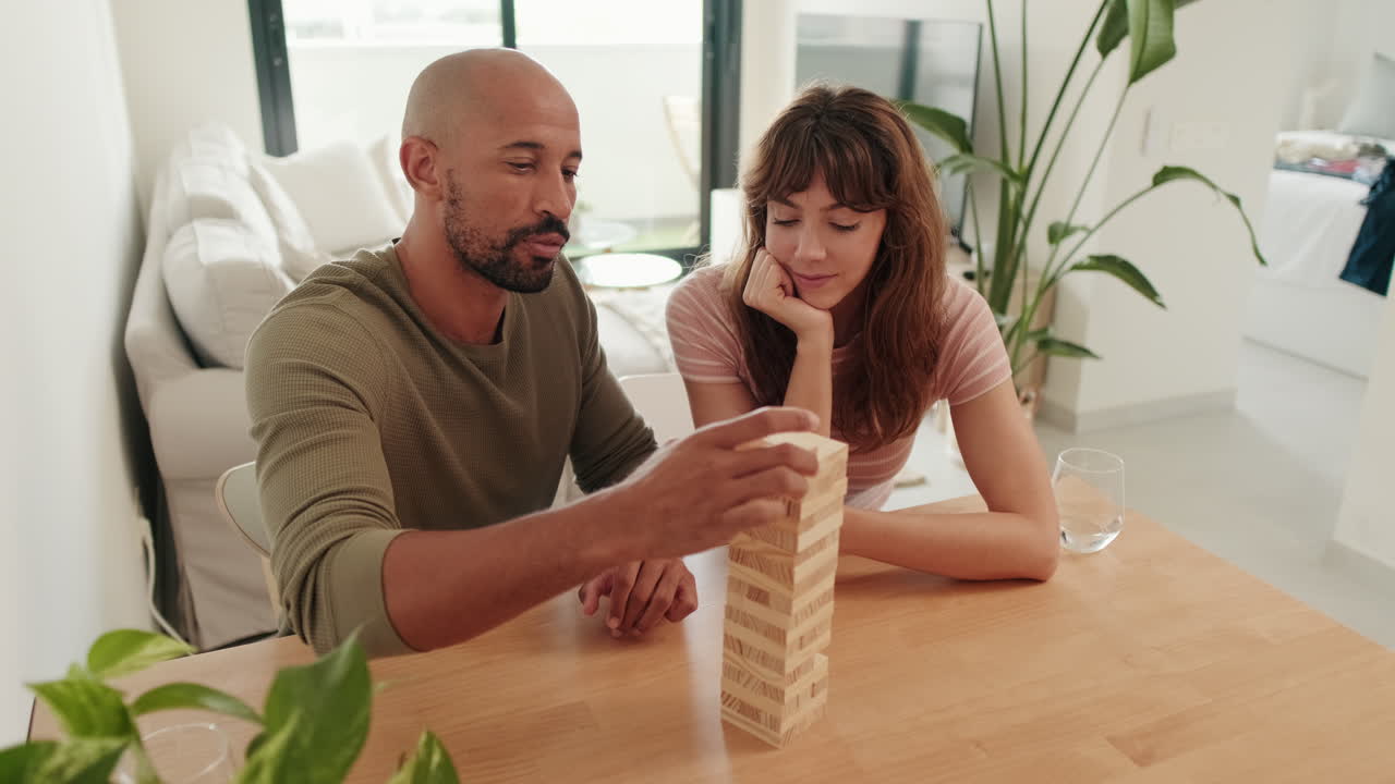 Couple Playing Jenga at Home